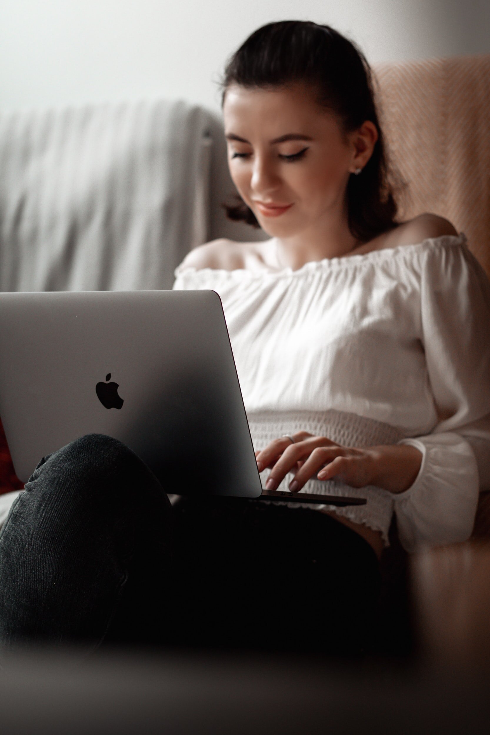 Woman on laptop doing online therapy